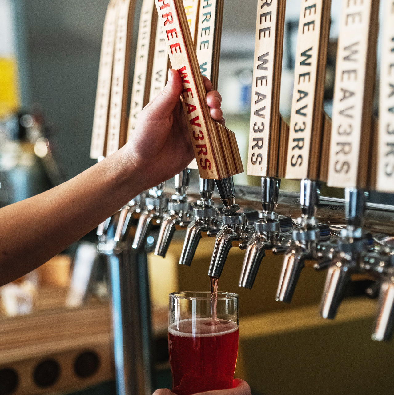 Tap handles on a draft wall